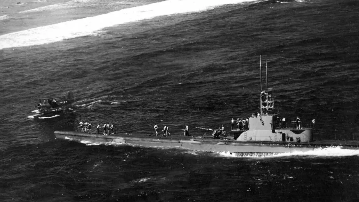 Harder rescuing VF-8 pilot Ens. John R. Galvin off Woleai, 1 April 1944.